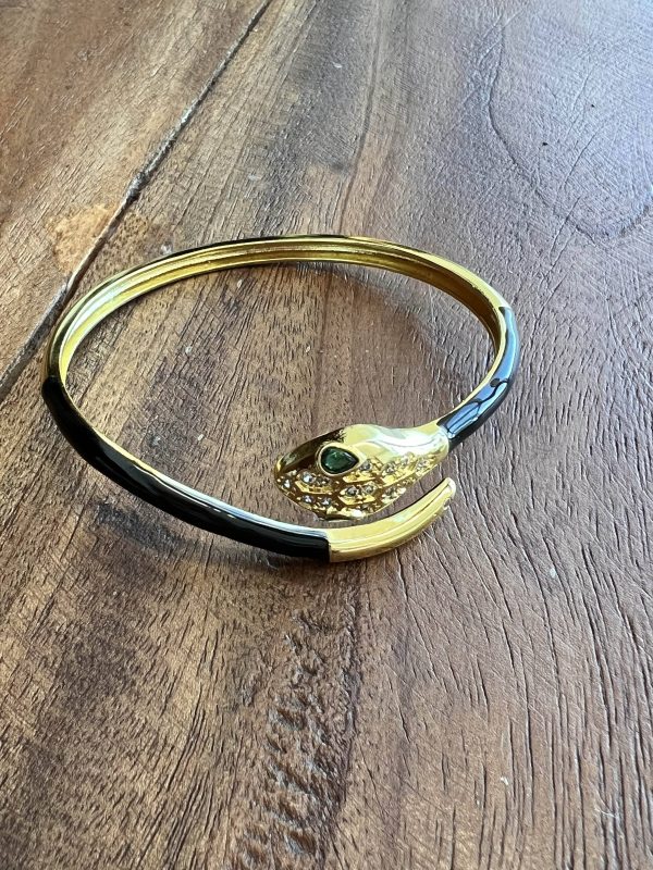 Pulsera acero dorado adaptable serpiente negra con ojos verdes y brillantes
